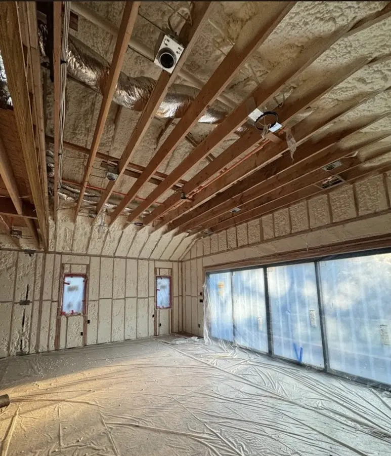 Interior walls and ceiling insulated with spray foam during new construction in Harwinton